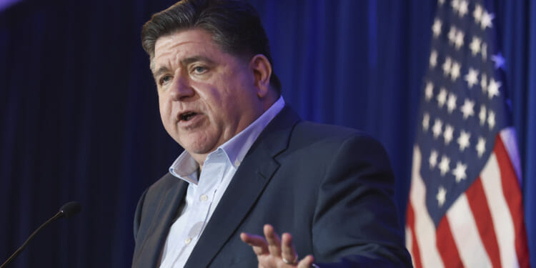 Pritzker stands between public school students, academic help