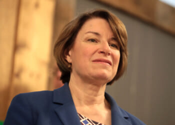 Sen. Klobuchar seeks sympathy for retired 61-year-old with six figure income who will have to vacation less if temporary taxpayer subsidies expire