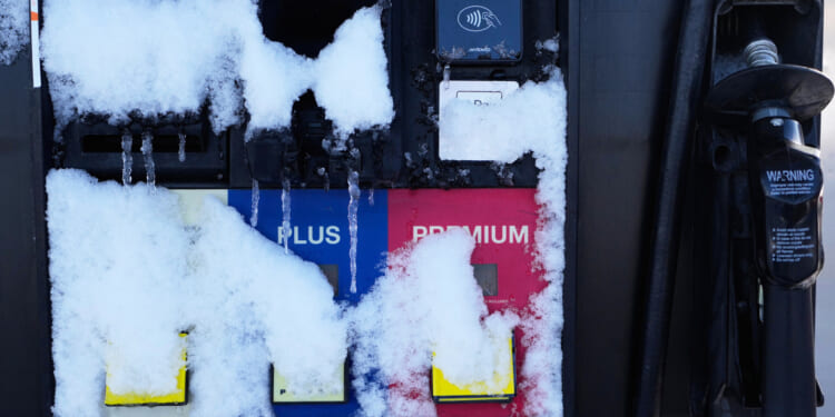 Gassing up in Illinois pricey during record holiday travel