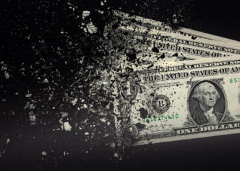 Dollars dissolving against a background; Kansas has a spending problem not a revenue problem.