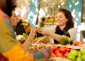 An exchange at a market, where free-market capitalism and free-trade are on display.