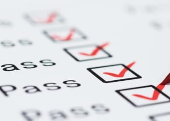 When grades and test scores conflict, what should parents rely on?