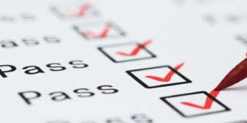 When grades and test scores conflict, what should parents rely on?