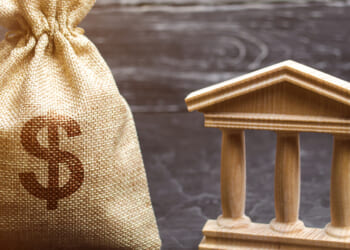 A,Bag,With,Dollar,Money,And,A,Bank,Or,Government