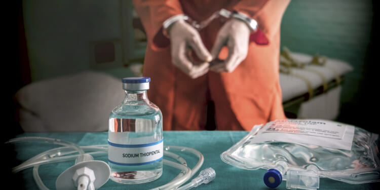 Prisoner,Handcuffed,To,Death,By,Lethal,Injection,,Vial,With,Sodium