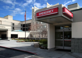 The outside of a rural hospital, image focused on the emergency room entrance.