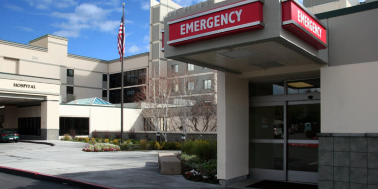 The outside of a rural hospital, image focused on the emergency room entrance.