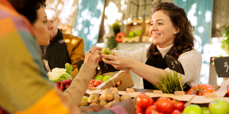An exchange at a market, where free market capitalism and free-trade are on display.