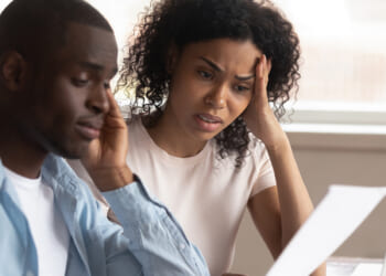 Troubled,Pensive,Biracial,Young,Couple,Feel,Disappointed,Consider,Paperwork,Paying