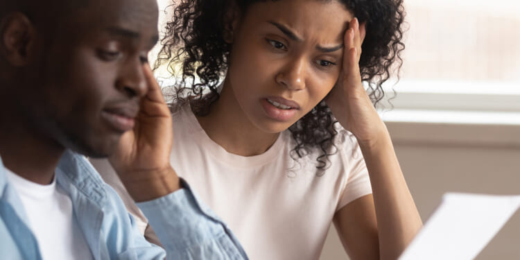 Troubled,Pensive,Biracial,Young,Couple,Feel,Disappointed,Consider,Paperwork,Paying