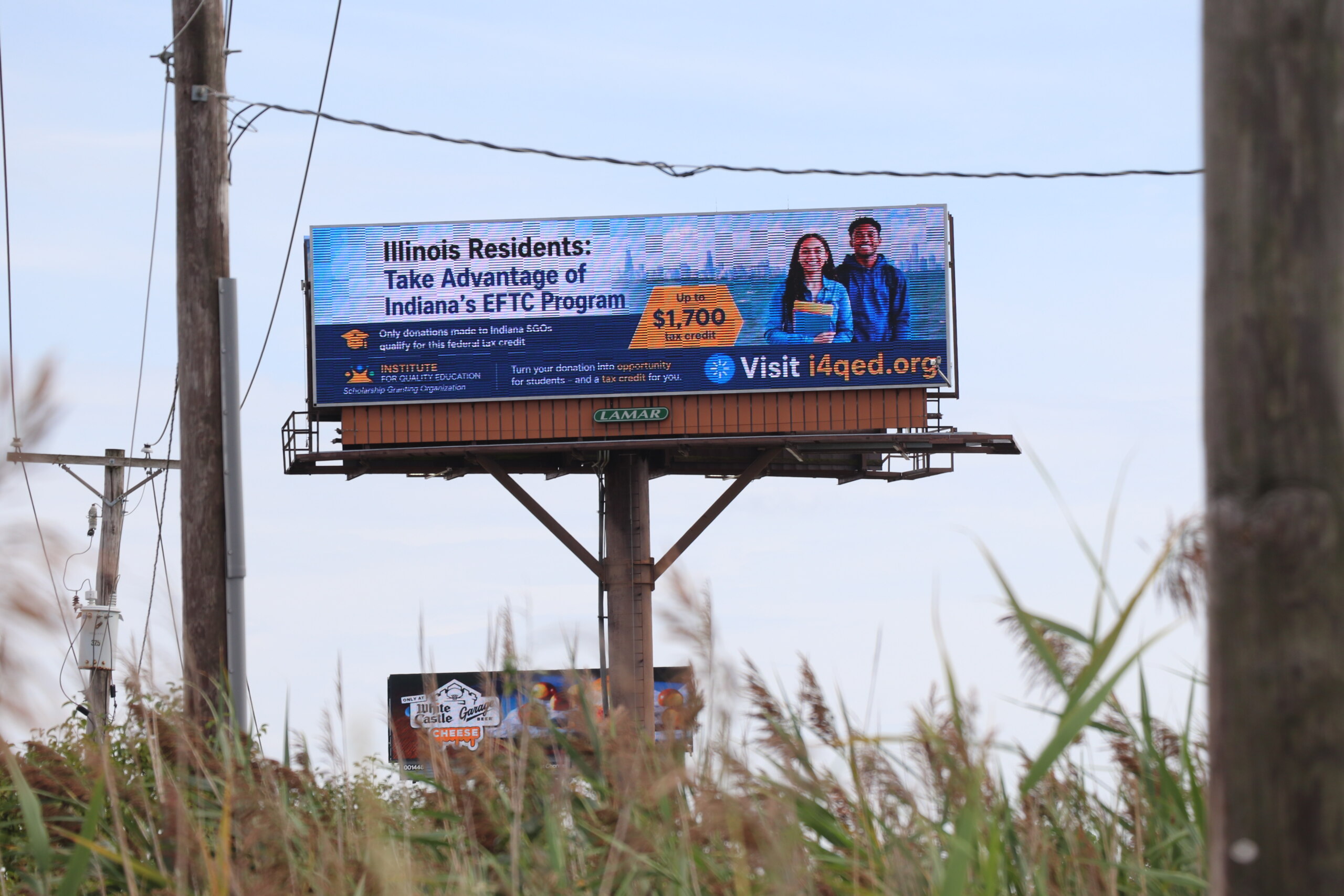 Billboard in Indiana urging Illinois residents to take advantage of the Indiana EFTC program for a $1,700 tax credit.